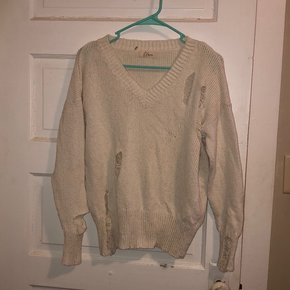 Distressed cream sweater